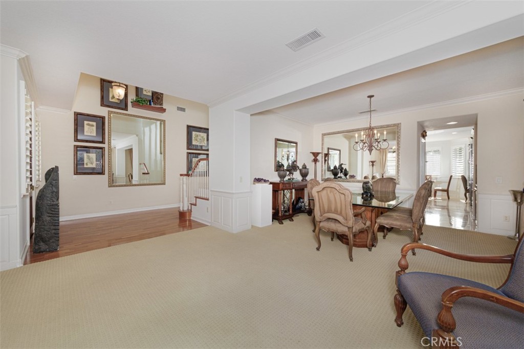 17722 Neff Ranch Road Yorba Linda, CA 92886 - Photo 6 of 63 Spacious living room with crown molding and wainscoting opens to the formal dining room.