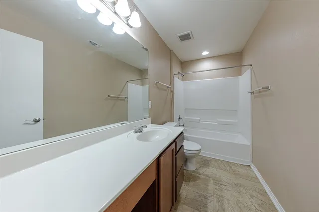 a bathroom with a sink a vanity and a mirror