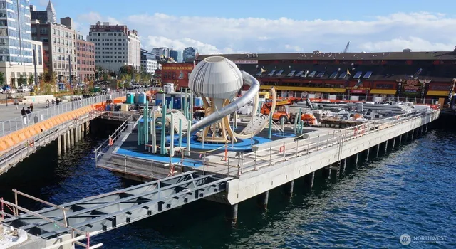 a view of a balcony with wooden floor and city view