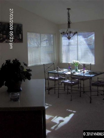 7583 Water View Way Reno, NV 89511 - Photo 4 of 7 a view of a dining room with furniture