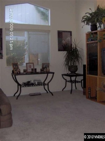 7583 Water View Way Reno, NV 89511 - Photo 5 of 7 a room with furniture and a potted plant