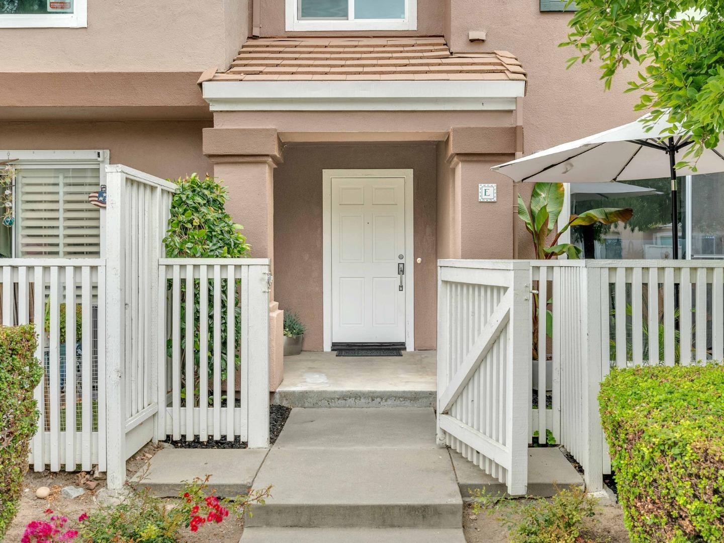 6978 Gregorich Drive, Unit E San Jose, CA 95138 - Photo 2 of 24 a view of a house with wooden floor and a potted plant
