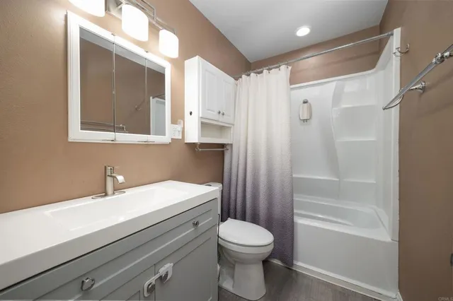 a view of a hallway with washer and dryer