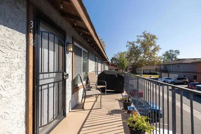 a balcony view with a seating space
