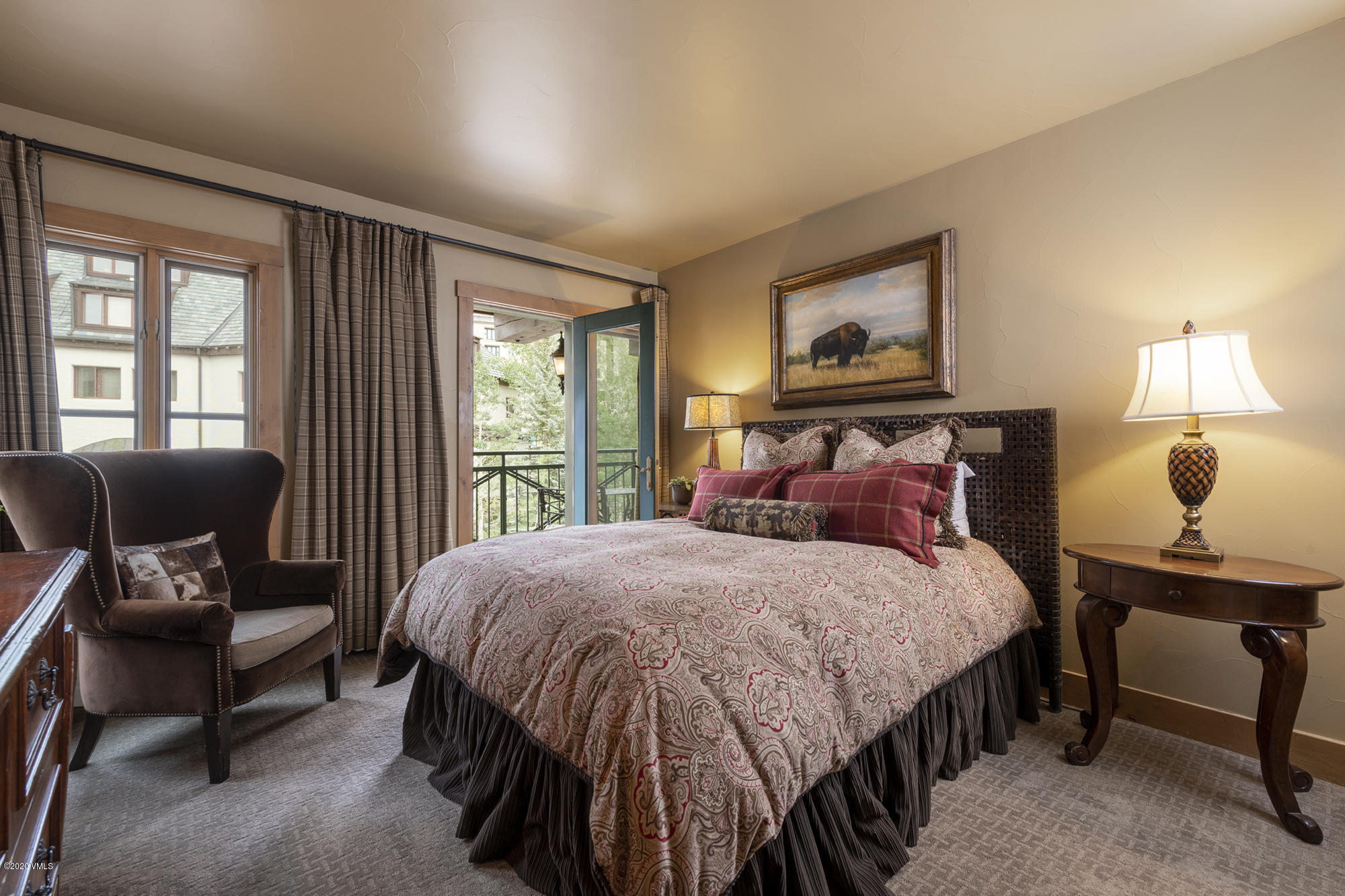 63 Avondale Lane, Unit R215 Beaver Creek, CO 81620 - Photo 14 of 26 a bedroom with a bed and large windows