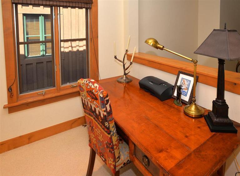 63 Avondale Lane, Unit R215 Beaver Creek, CO 81620 - Photo 16 of 26 a bedroom with bed and balcony