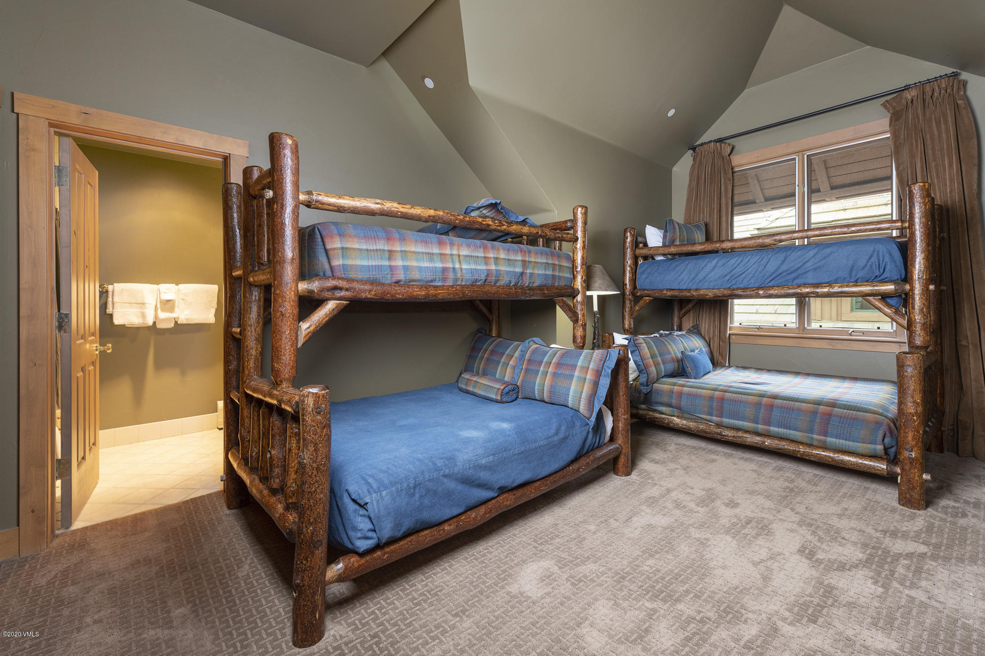 63 Avondale Lane, Unit R215 Beaver Creek, CO 81620 - Photo 17 of 26 a bedroom with bed and a window