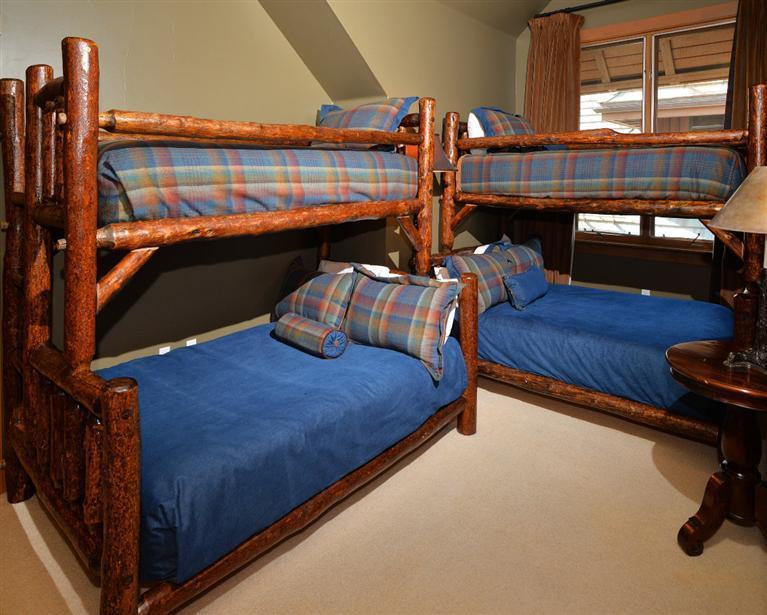 63 Avondale Lane, Unit R215 Beaver Creek, CO 81620 - Photo 18 of 26 a bed room with furniture and a closet