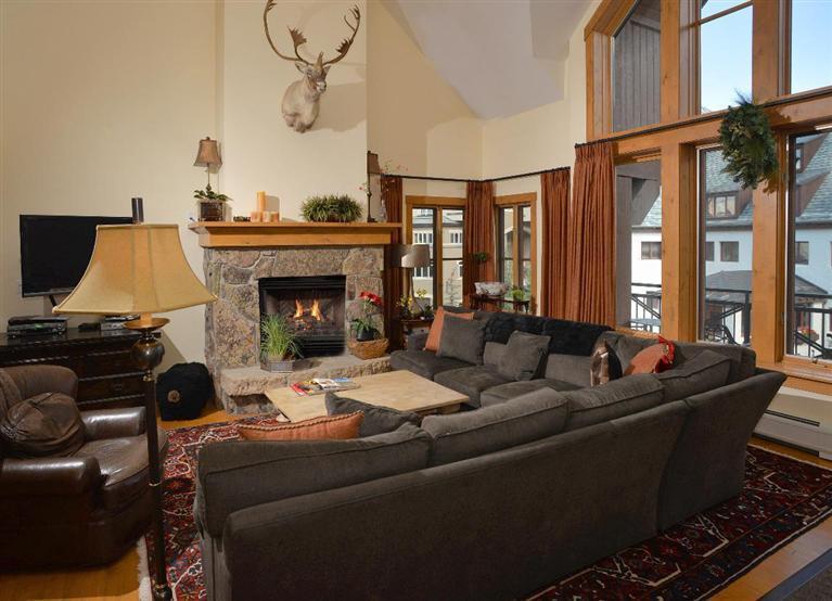 63 Avondale Lane, Unit R215 Beaver Creek, CO 81620 - Photo 5 of 26 a living room with furniture and a fireplace