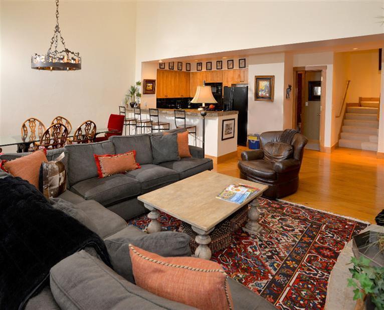 63 Avondale Lane, Unit R215 Beaver Creek, CO 81620 - Photo 6 of 26 a living room with furniture a rug and a fireplace