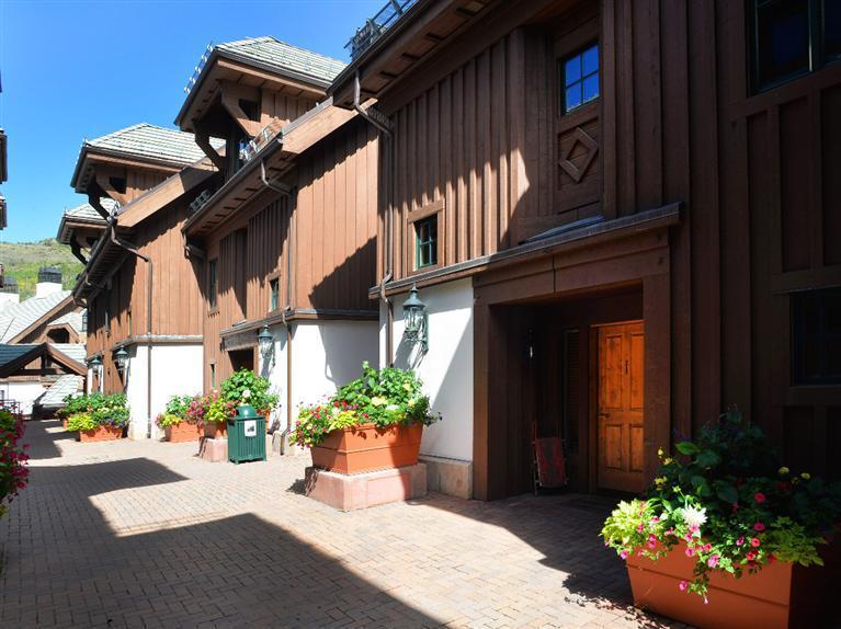 63 Avondale Lane, Unit R215 Beaver Creek, CO 81620 - Photo 8 of 26 a view of a house with a yard and plants