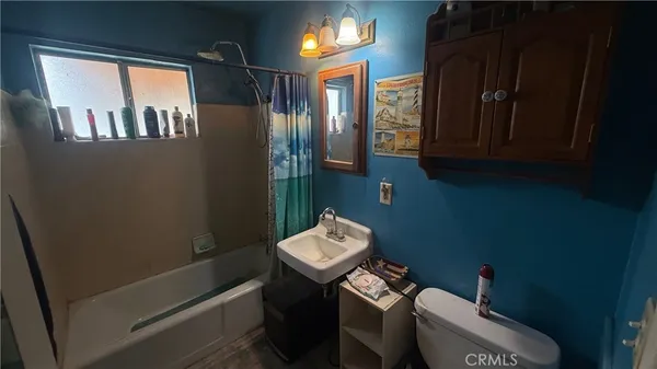 a bathroom with a sink toilet and vanity