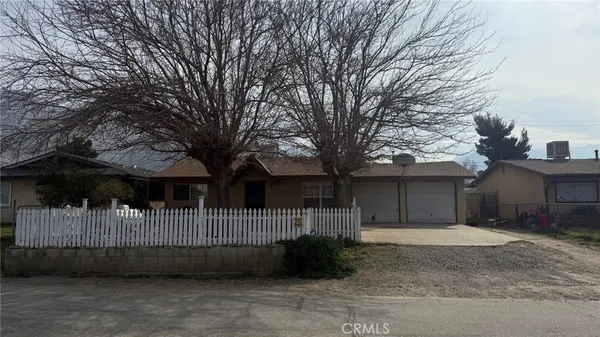 a front view of a house with parking
