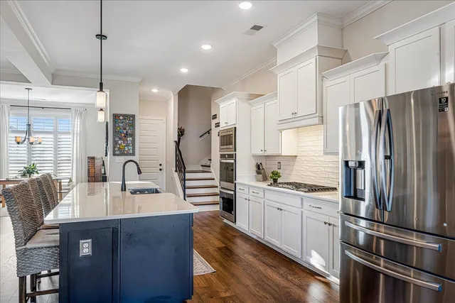 a kitchen with refrigerator cabinets and furniture