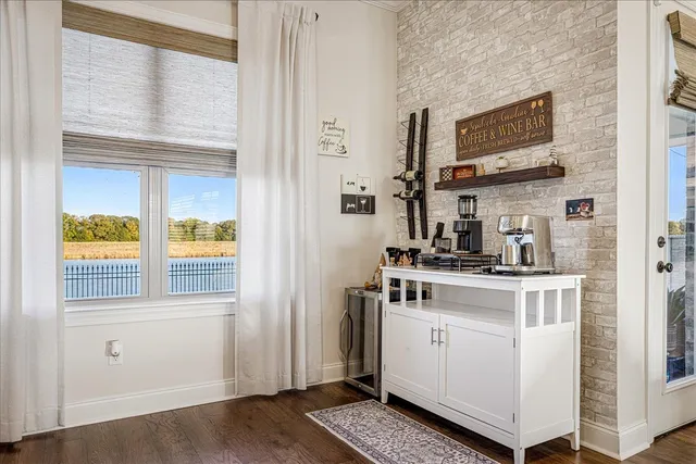 a kitchen with a sink cabinets and a window