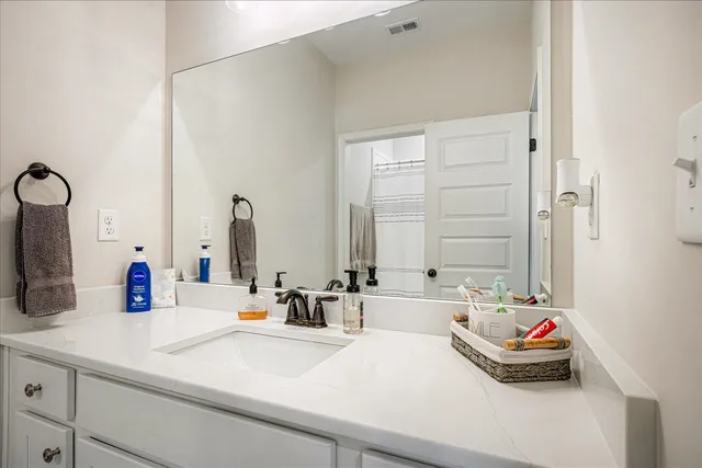 a bathroom with sink and a mirror