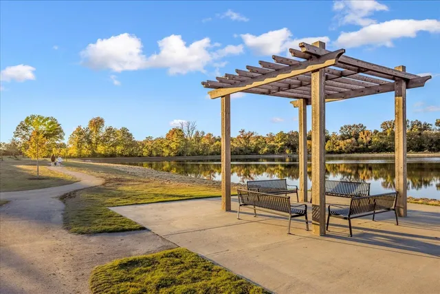 a view of a patio with swimming pool table and chairs