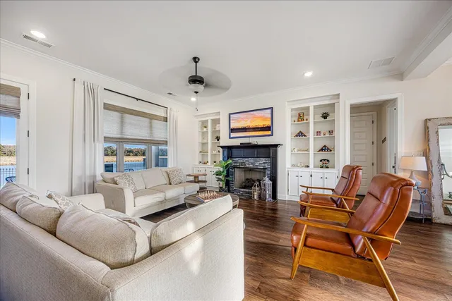 a living room with furniture flat screen tv and a fireplace