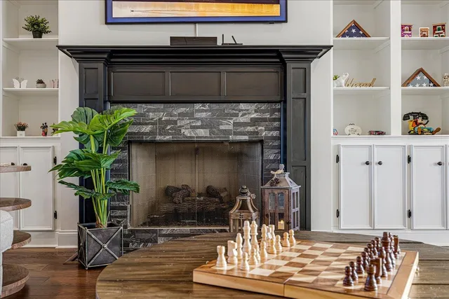 a kitchen with a potted plant on the counter and cabinets