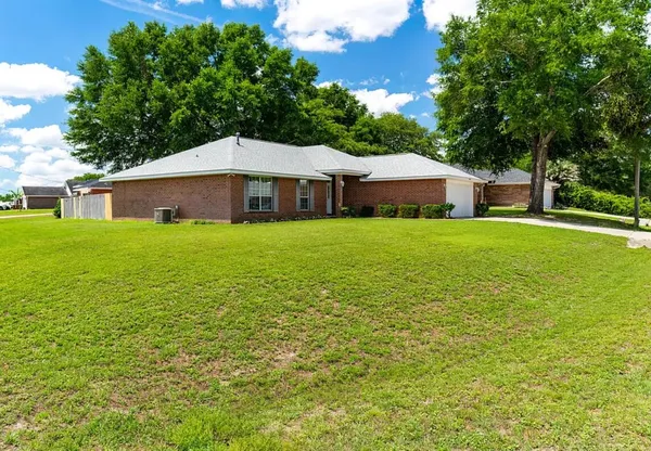 a house with a tree in front of it