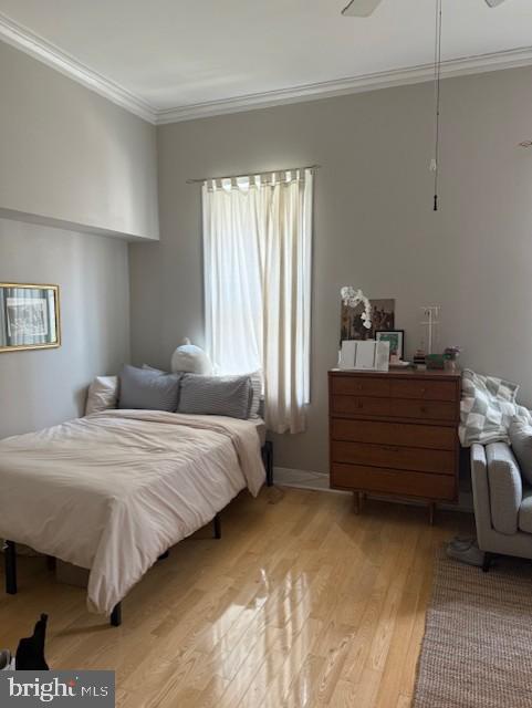 1504 Mt Vernon Street, Unit 2F Philadelphia, PA 19130 - Photo 3 of 7 a bedroom with a bed and window