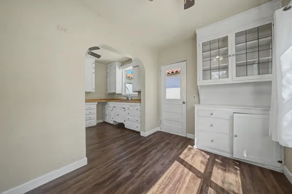 a view of a bedroom with closet and windows