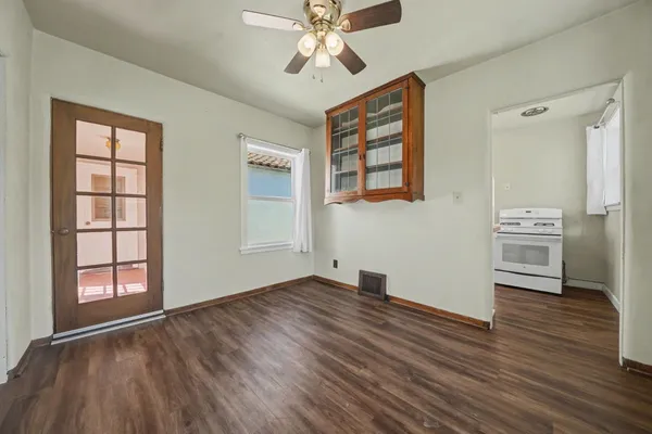 wooden floor in an empty room with a window