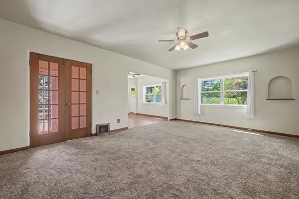 a view of an empty room with a window