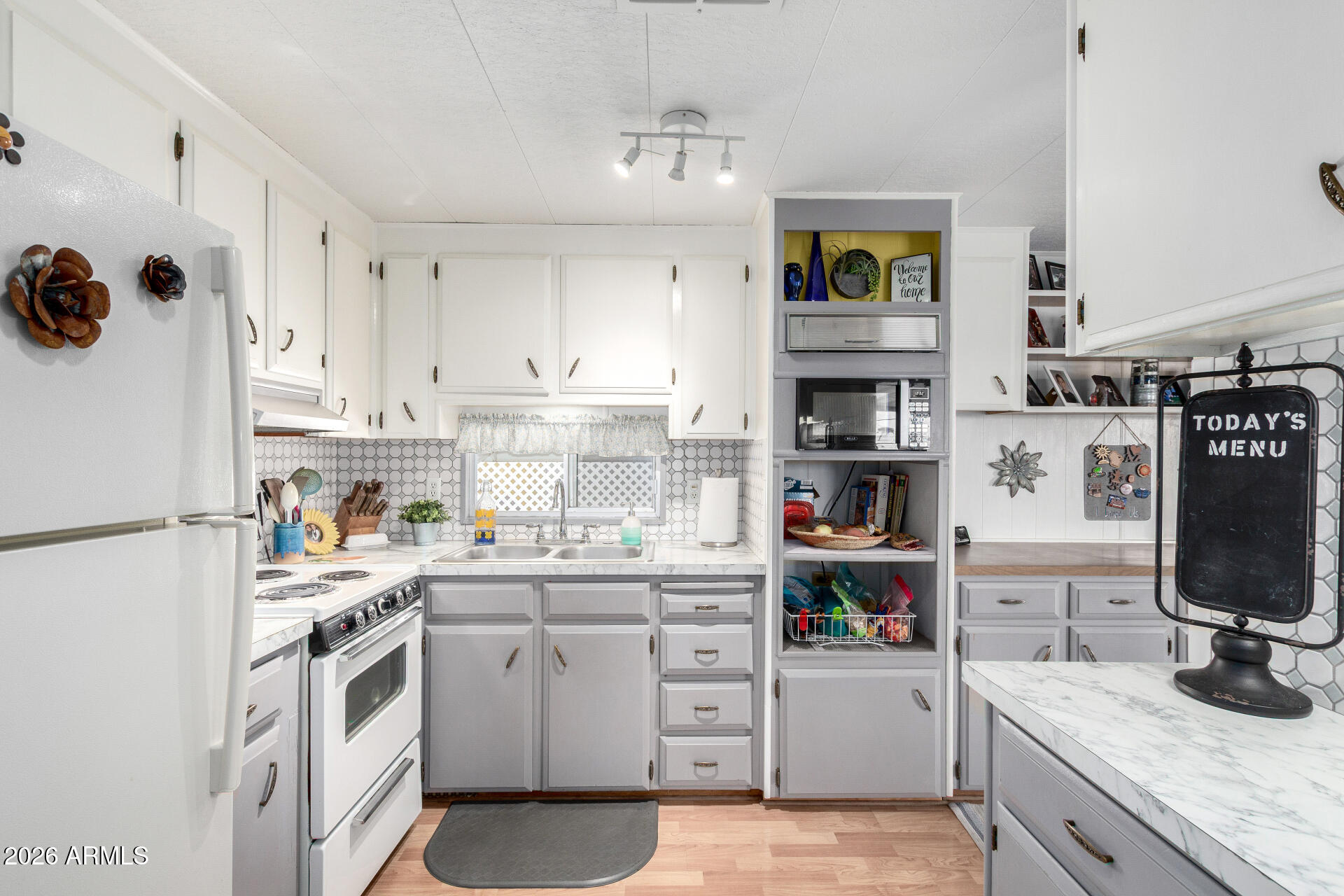 800 West Apache Trail, Unit 93 Apache Junction, AZ 85120 - Photo 7 of 28 a kitchen with cabinets appliances and a window