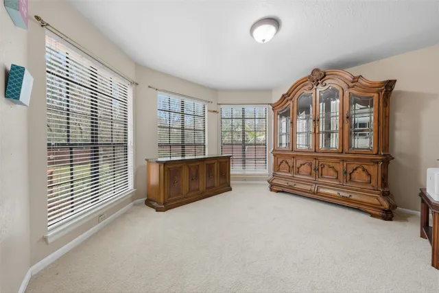 an aerial view of a house with a yard basket ball court and outdoor seating