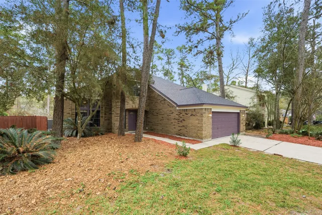 a view of a house with backyard porch and sitting area