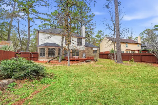 a kitchen with stainless steel appliances granite countertop a stove top oven a sink dishwasher and a refrigerator