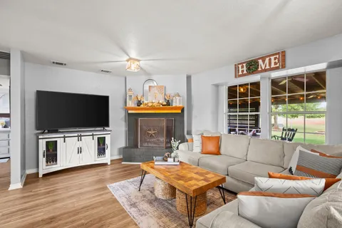 a living room with furniture and a flat screen tv