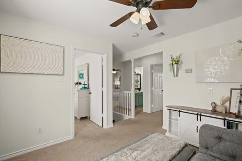 a view of a livingroom with a ceiling fan