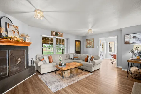 a living room with furniture and a fireplace