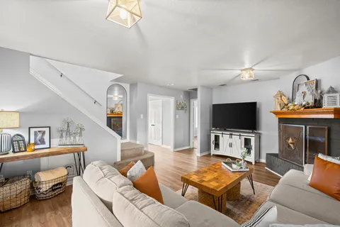 a living room with furniture and a flat screen tv