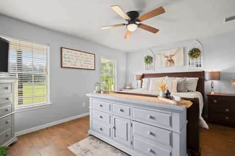 a bedroom with a bed and a window