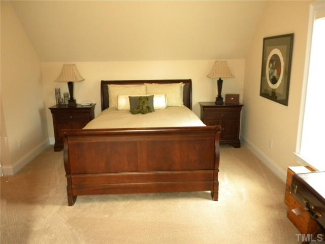 3704 Laurel Hills Road Raleigh, NC 27612 - Photo 16 of 25 Ample bedroom with custom bulit in seating for storage in dormer. Bedroom