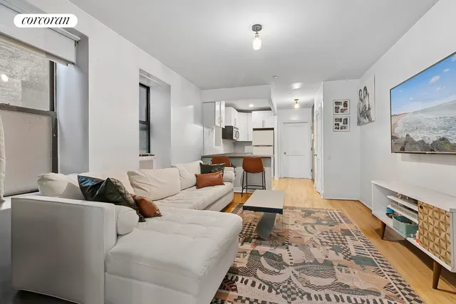 a kitchen with stainless steel appliances a stove a refrigerator and a microwave