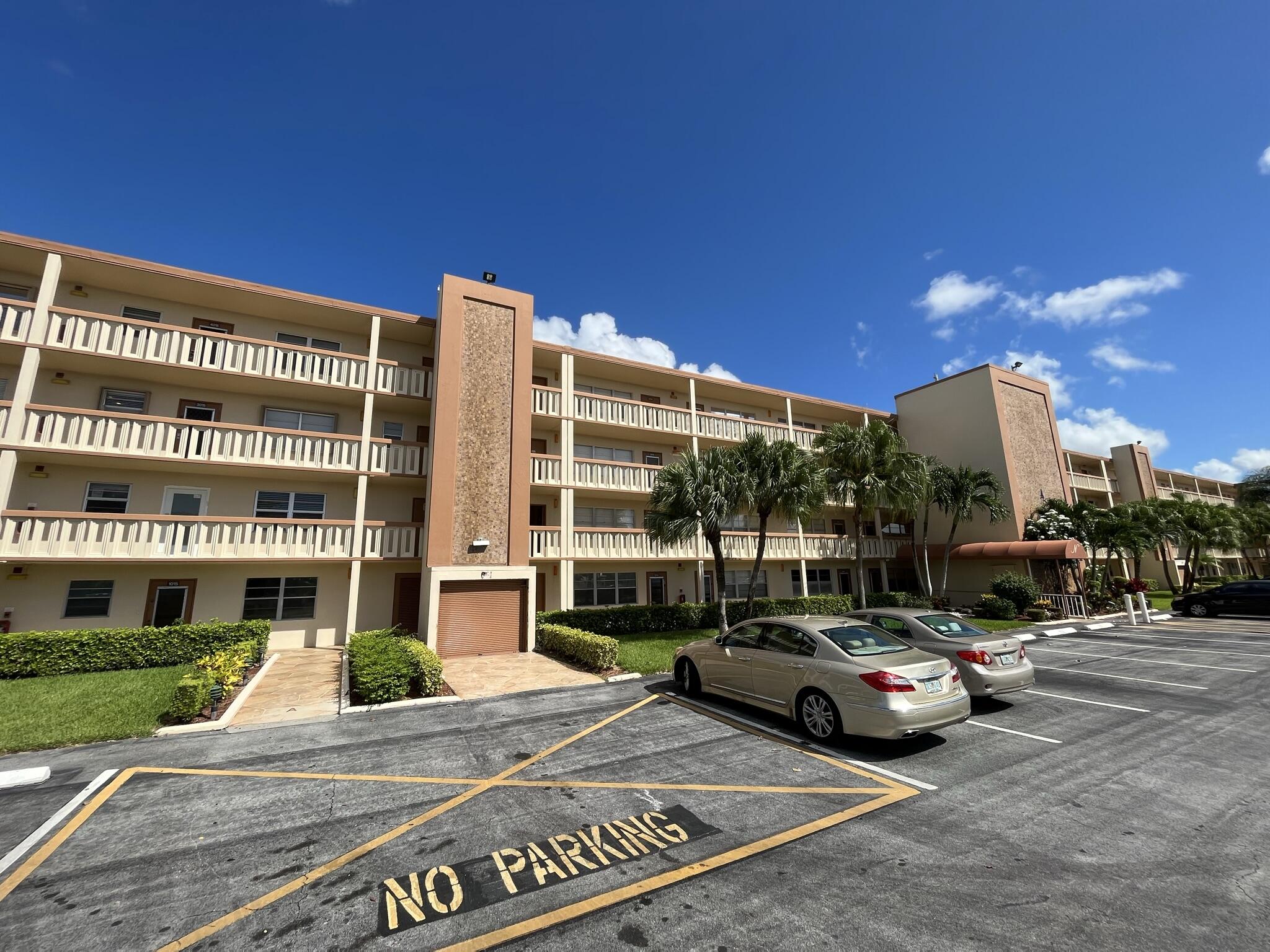 3013 Newcastle A Boca Raton, FL 33434 - Photo 1 of 19 a view of building with cars parked across