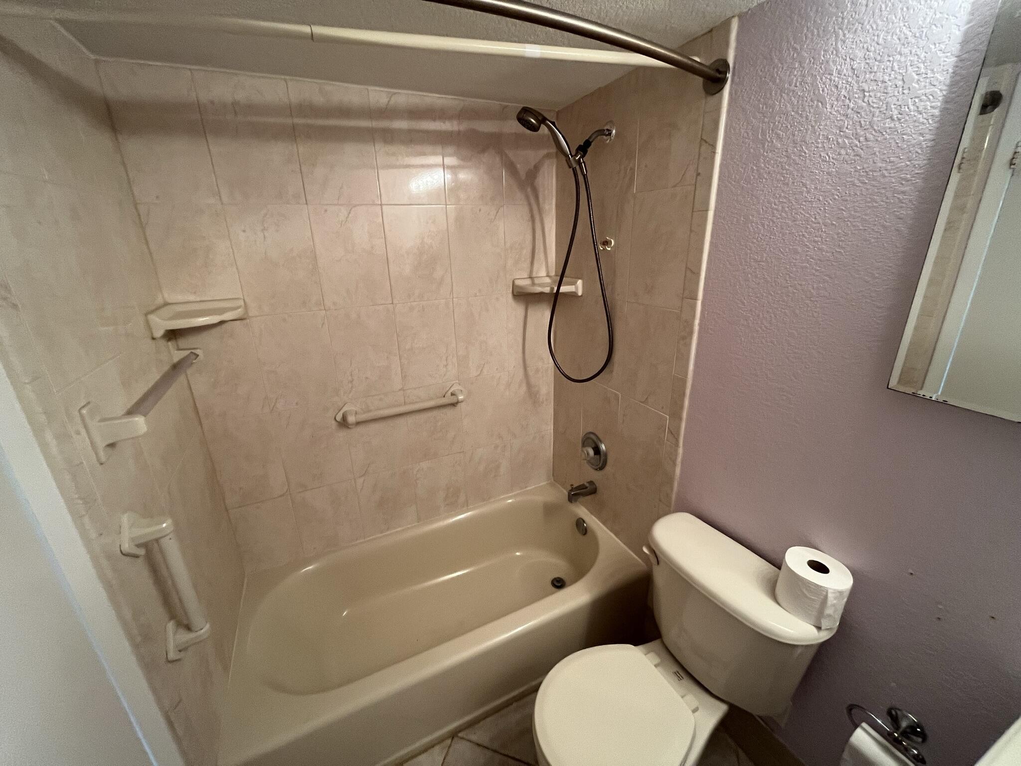 3013 Newcastle A Boca Raton, FL 33434 - Photo 15 of 19 a bathroom with a toilet and a shower