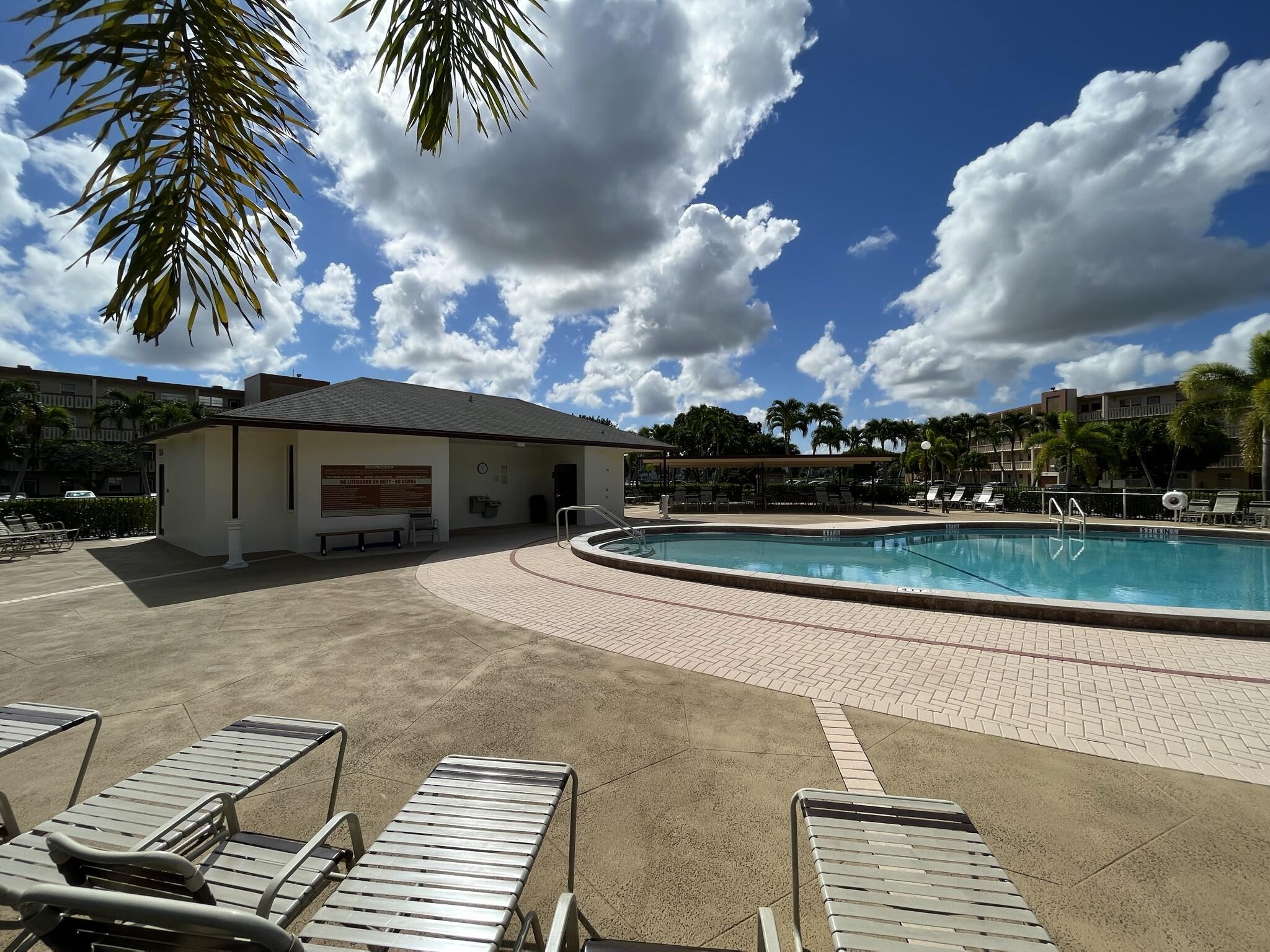 3013 Newcastle A Boca Raton, FL 33434 - Photo 19 of 19 a front view of a house with garden