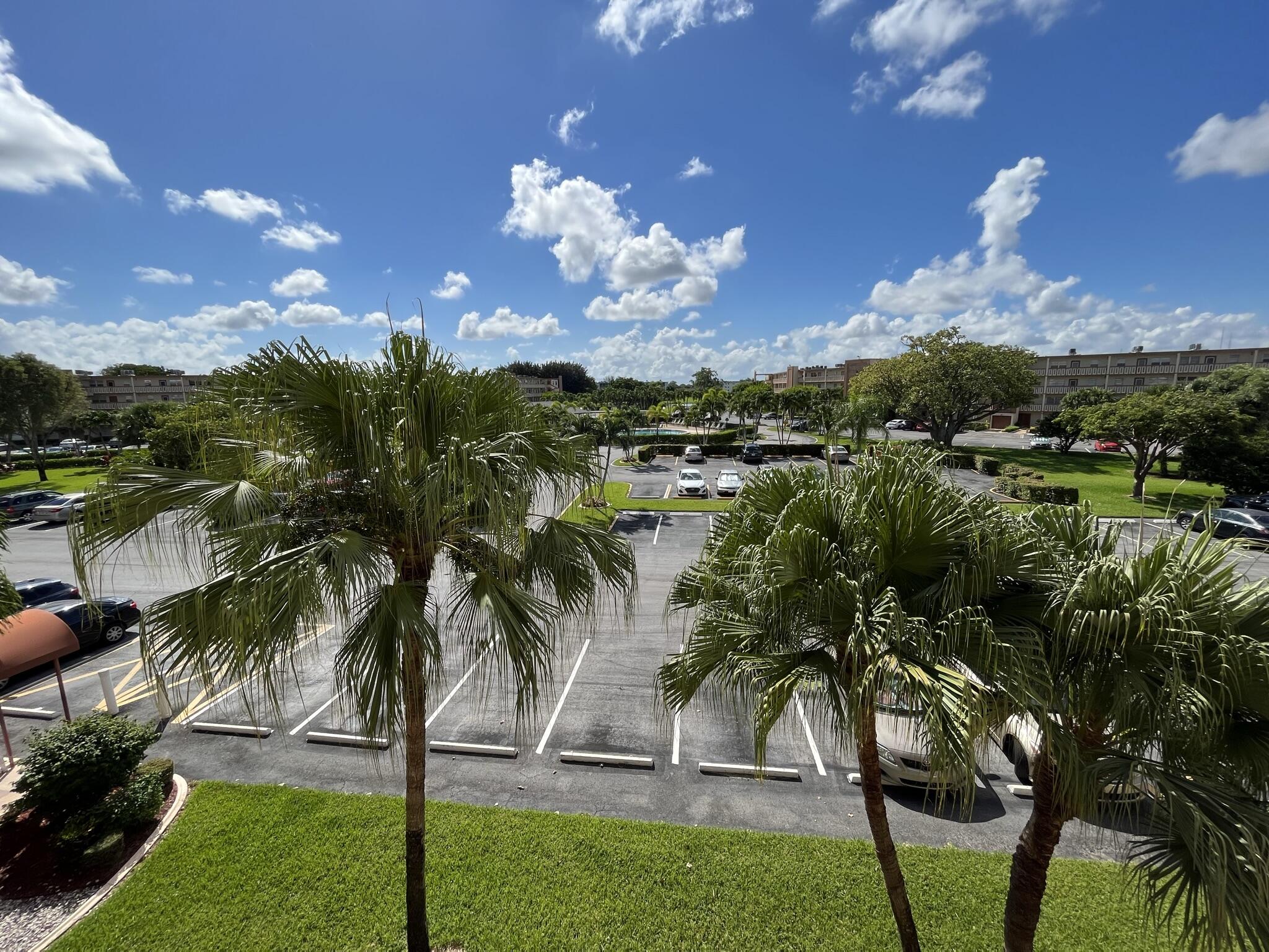 3013 Newcastle A Boca Raton, FL 33434 - Photo 3 of 19 a view of a yard with palm trees