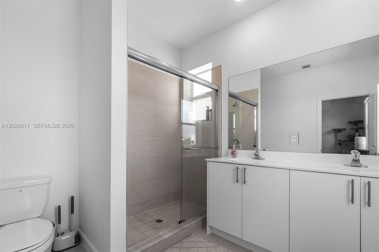 26455 Southwest 148th Avenue Homestead, FL 33032 - Photo 22 of 35 a bathroom with a sink toilet and shower