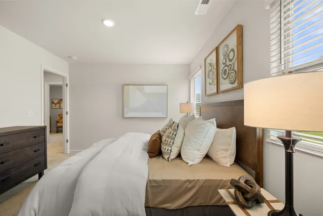 a view of a livingroom with furniture and windows