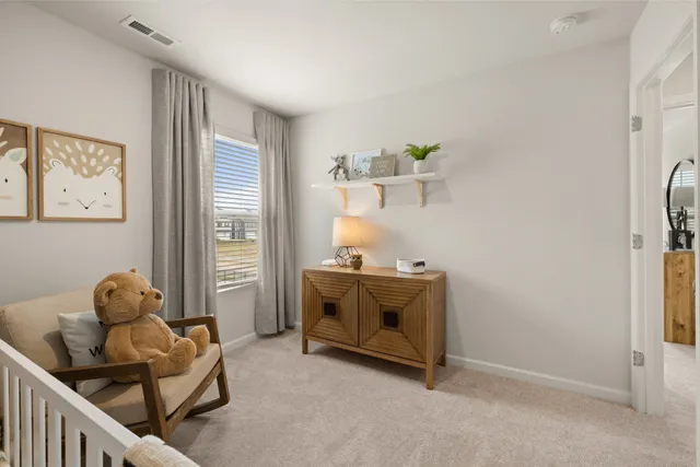 a bedroom with bed and a window