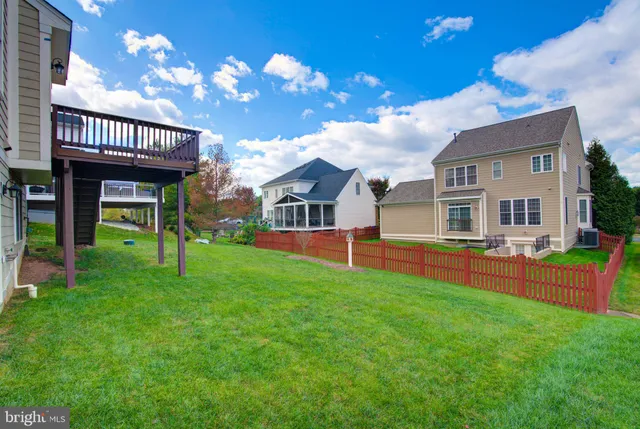 a view of a house with a backyard porch and sitting area