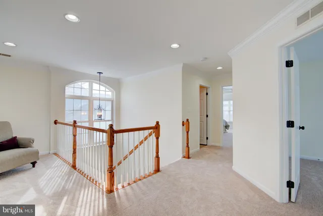 a living room with furniture and windows