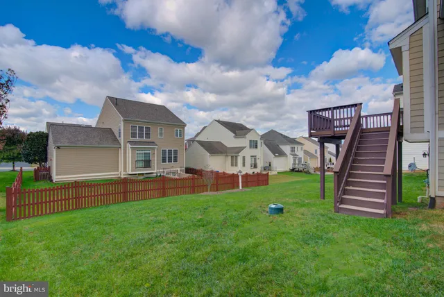 a front view of a house with a yard table and chairs