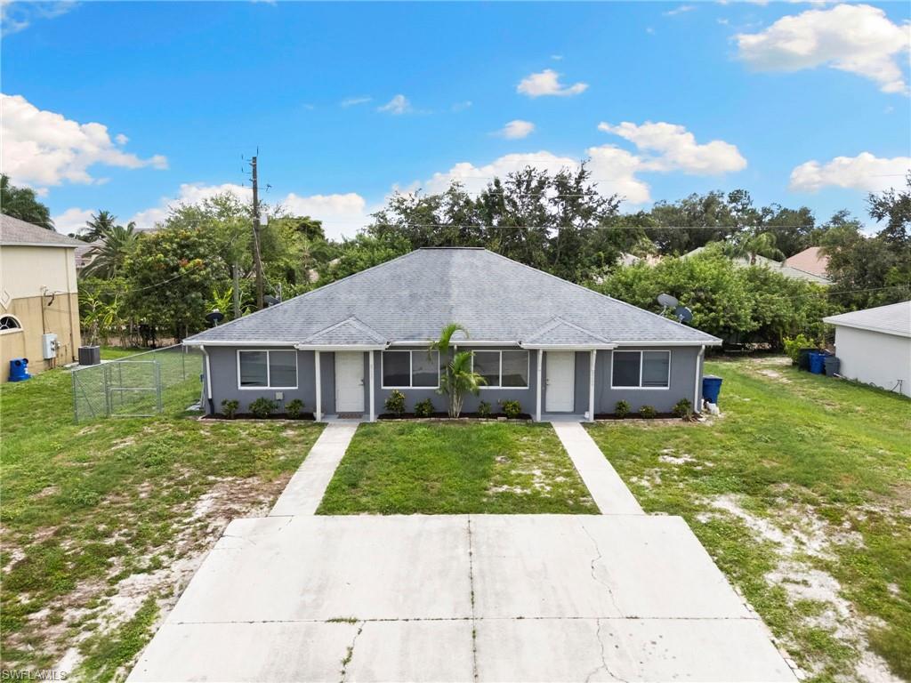 8264-8268 Matanzas Road Fort Myers, FL 33967 - Photo 31 of 33 a view of a house with a yard
